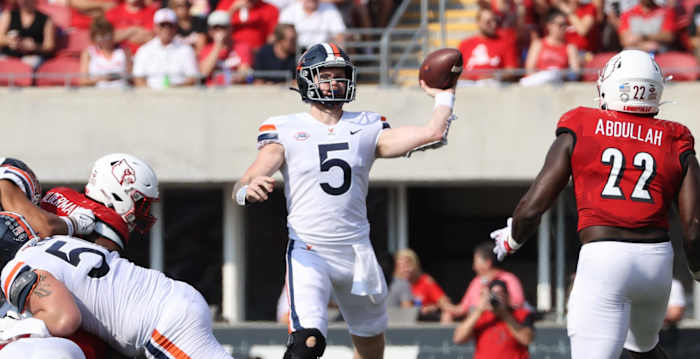 Virginia Cavaliers quarterback Brennan Armstrong (5) against the Louisville Cardinals during the second half at Cardinal Stadium. Virginia defeated Louisville 34-33.